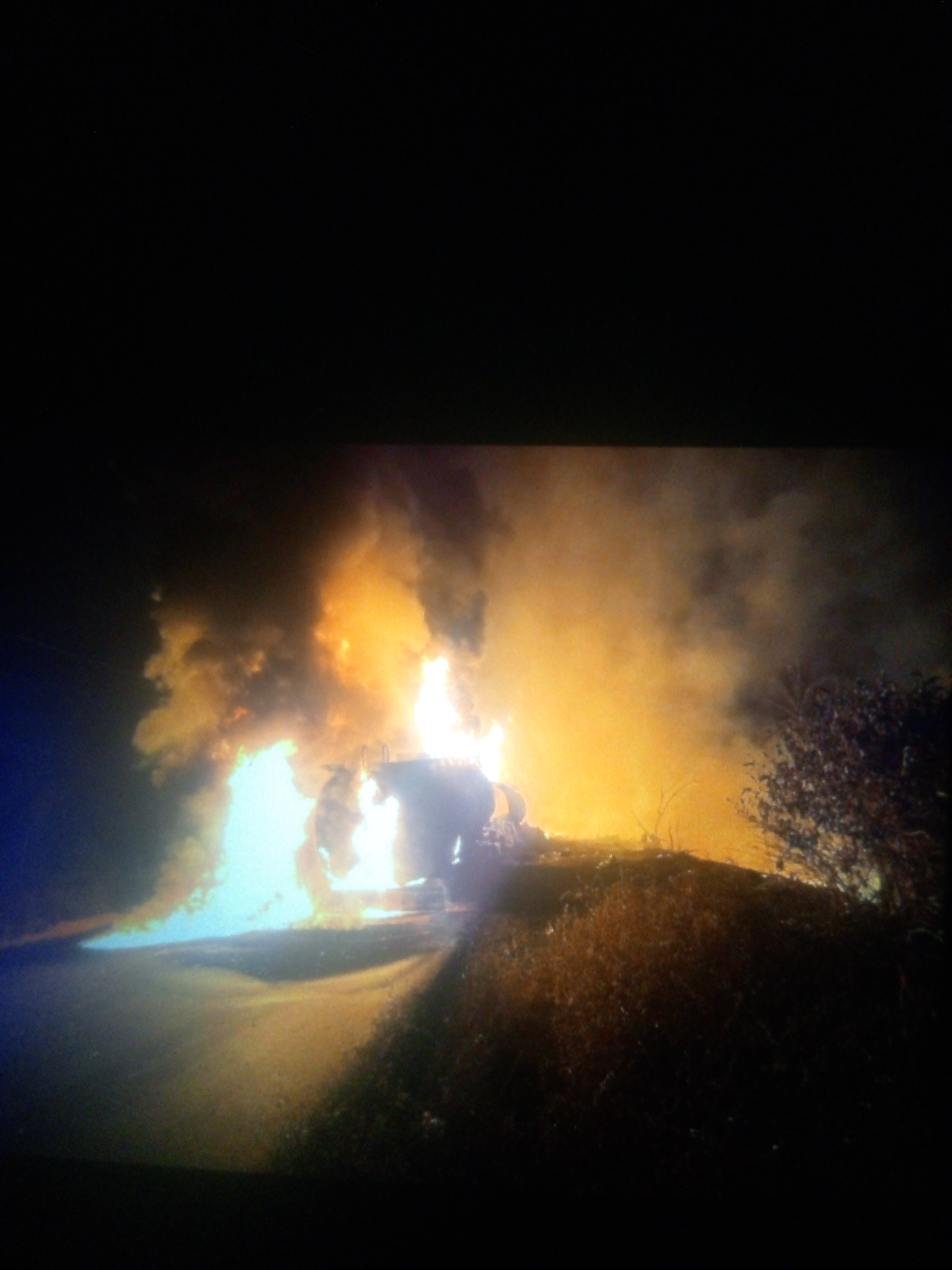 Burning tankers with crude